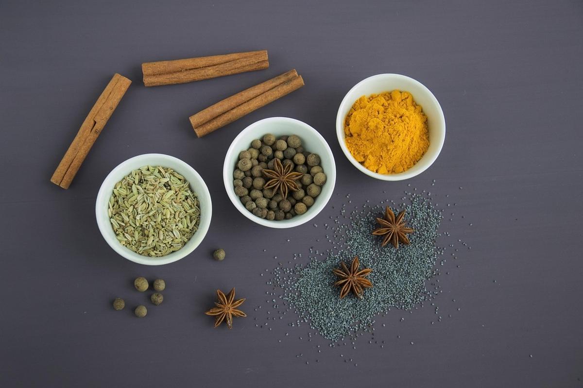 A colorful spread of Pakistani dishes including lentils, vegetables, and whole wheat roti