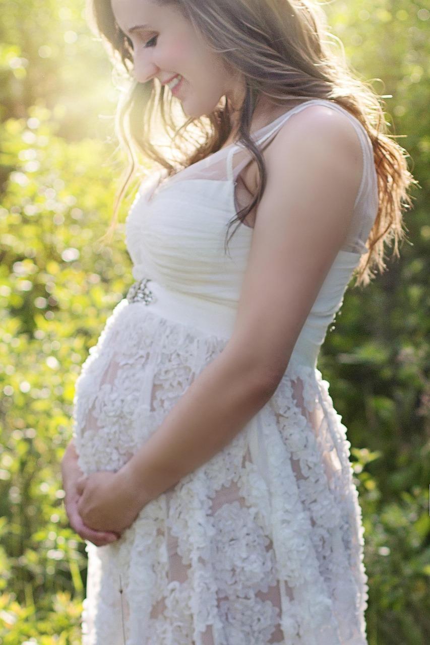 Doctor discussing prenatal healthcare plan with expectant couple