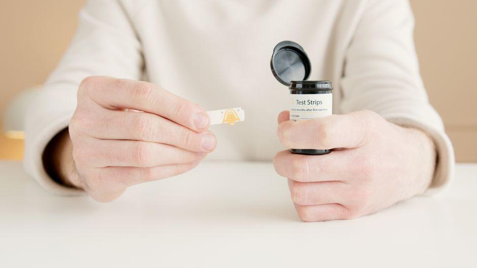 Vials of blood glucose test strips on a pharmacy counter