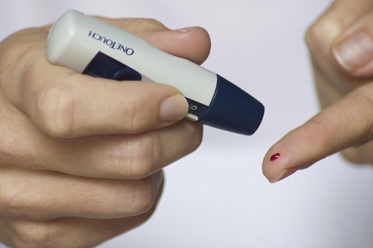 Blood test paperwork showing fasting and random glucose measurements